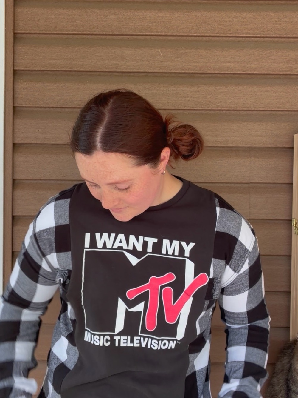 MTV Black Tee with Red TV Logo and Black‑White Check Sleeves